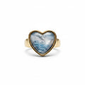 A heart-shaped gold ring with a blue marbled gemstone, shown from multiple angles on a clean white background.