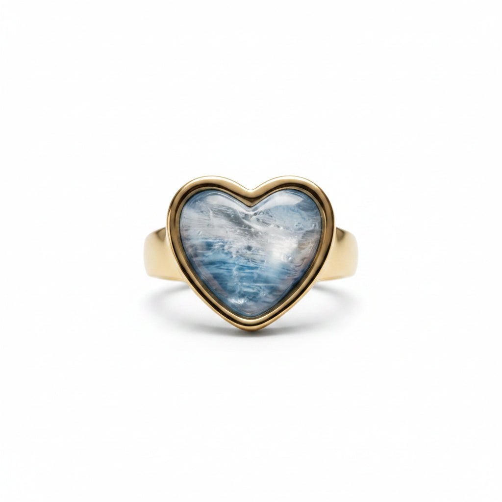 A heart-shaped gold ring with a blue marbled gemstone, shown from multiple angles on a clean white background.