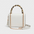 A structured white handbag shown from multiple angles on a clean white background, featuring a patterned scarf handle, gold-tone chain strap, tassel detail, and navy-and-gold scarf ends.