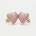 Four-panel product collage showing heart-shaped stud earrings with pink marbled inlay and polished gold-tone edges and posts, including front views, side views, and a close-up detail shot on a light gray background.