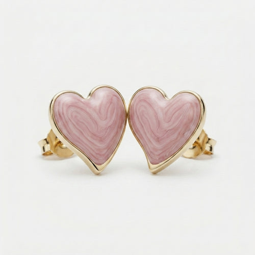 Four-panel product collage showing heart-shaped stud earrings with pink marbled inlay and polished gold-tone edges and posts, including front views, side views, and a close-up detail shot on a light gray background.