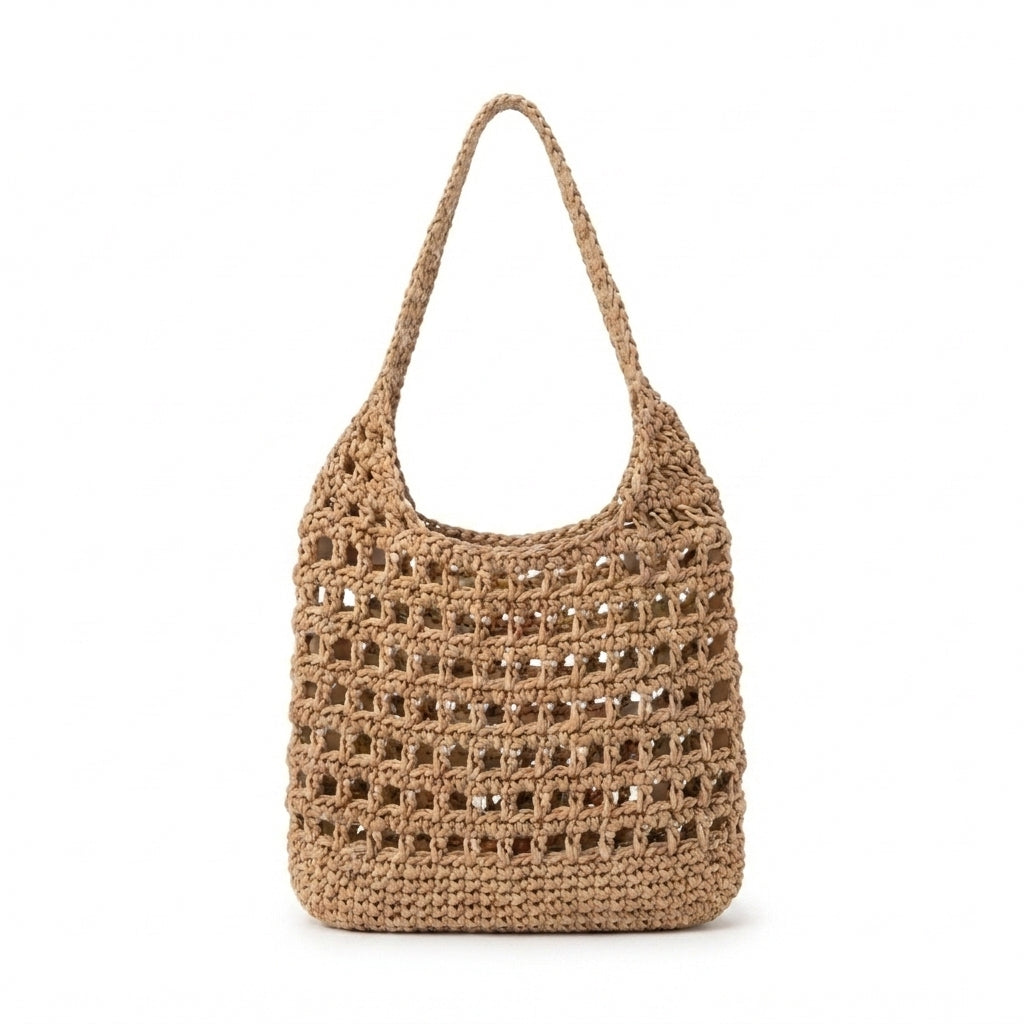 A natural beige woven straw shoulder bag with an openwork crochet pattern and a single shoulder strap, shown against a plain white background.
