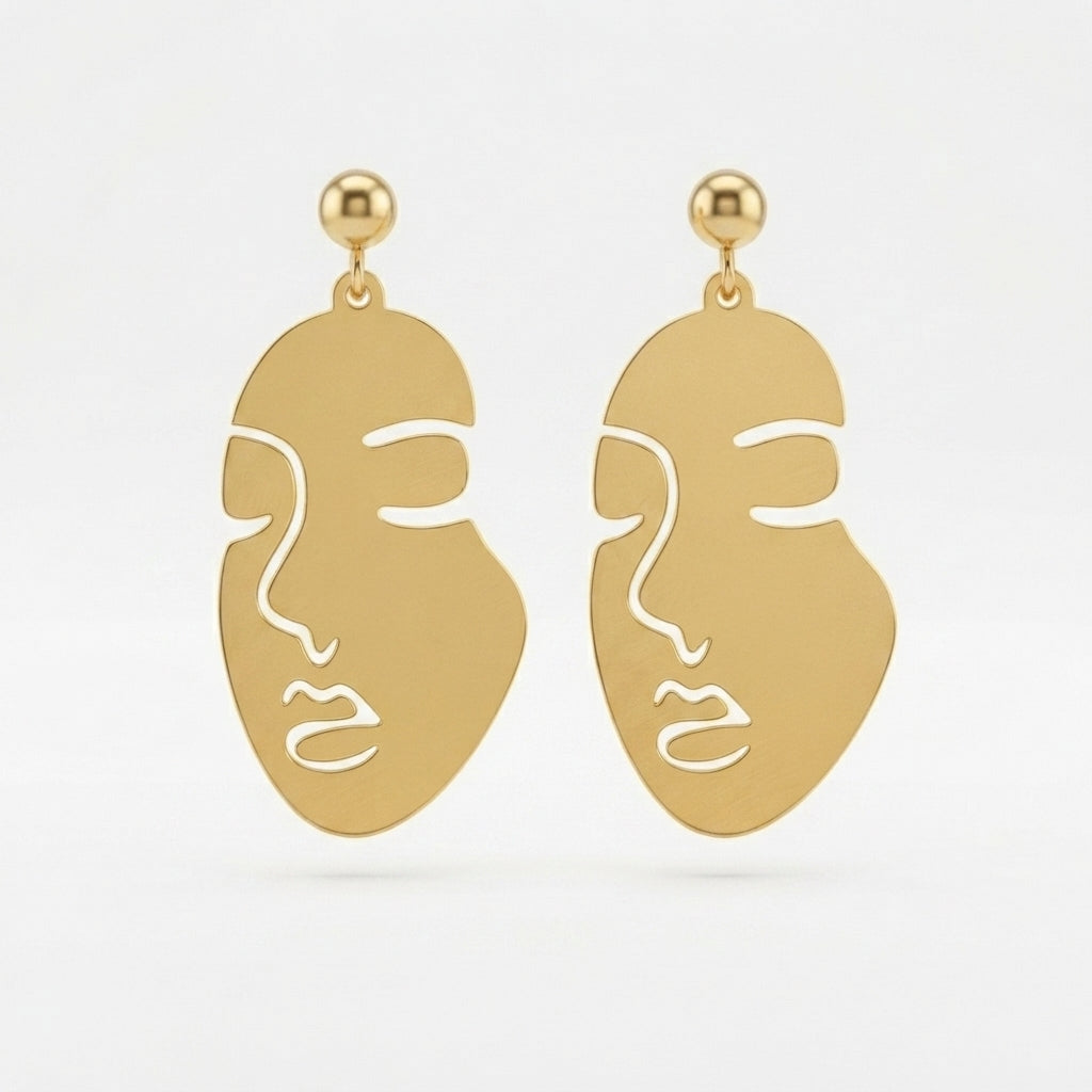 A 2x2 collage showing a pair of gold-tone statement earrings with a minimalist face cutout design. The top-left panel shows the earrings hanging against a white background, and the top-right panel shows them from the back with butterfly backings.