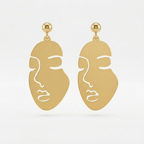 A 2x2 collage showing a pair of gold-tone statement earrings with a minimalist face cutout design. The top-left panel shows the earrings hanging against a white background, and the top-right panel shows them from the back with butterfly backings.