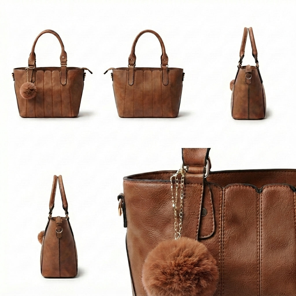 Brown faux-leather handbag shown from multiple angles on a white background, featuring dual top handles, a small hanging pom-pom charm, and a close-up of the front panel with the charm attached.