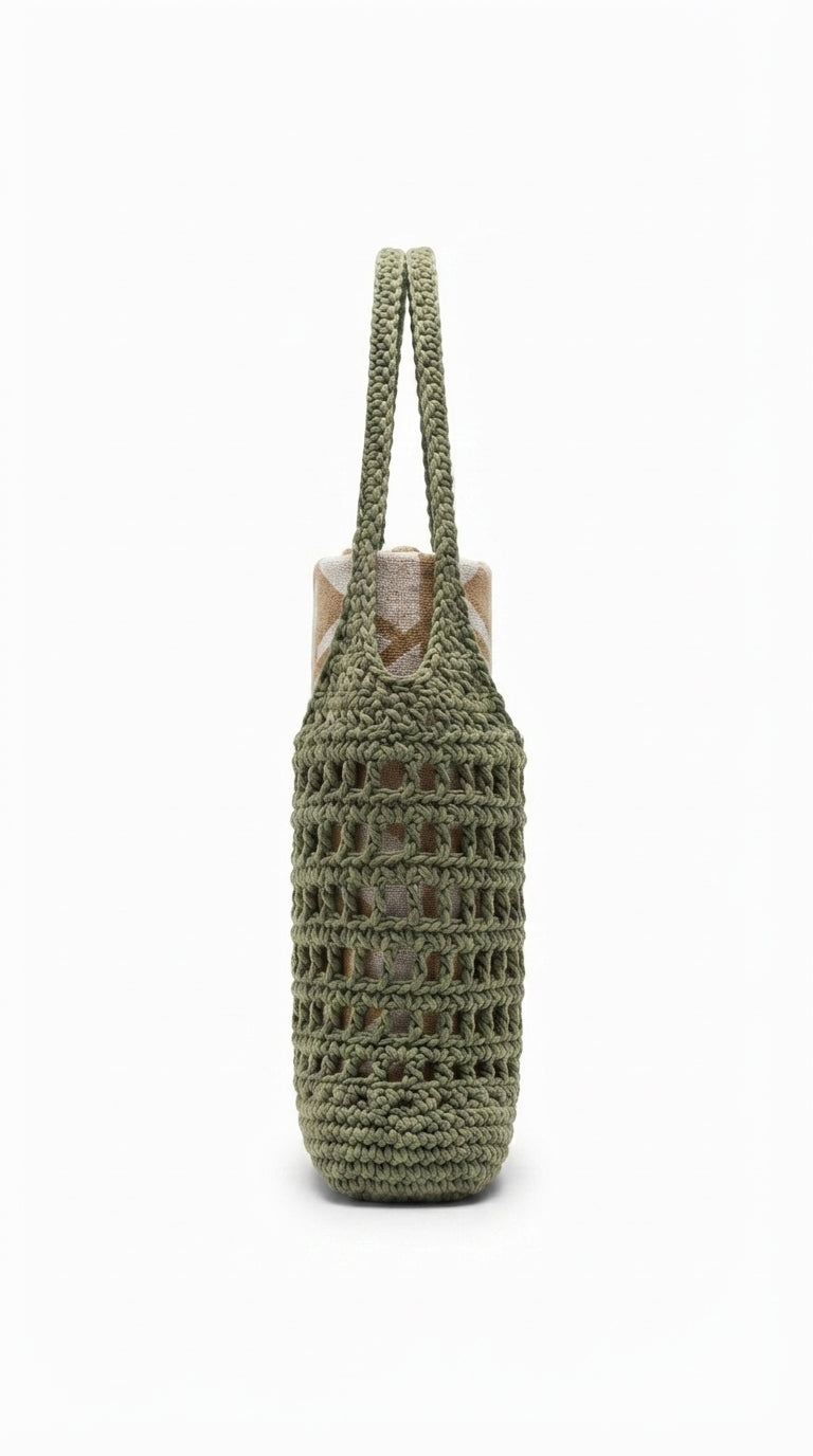 An olive green crocheted tote bag with a woven openwork pattern and two long shoulder straps, shown against a plain white background.